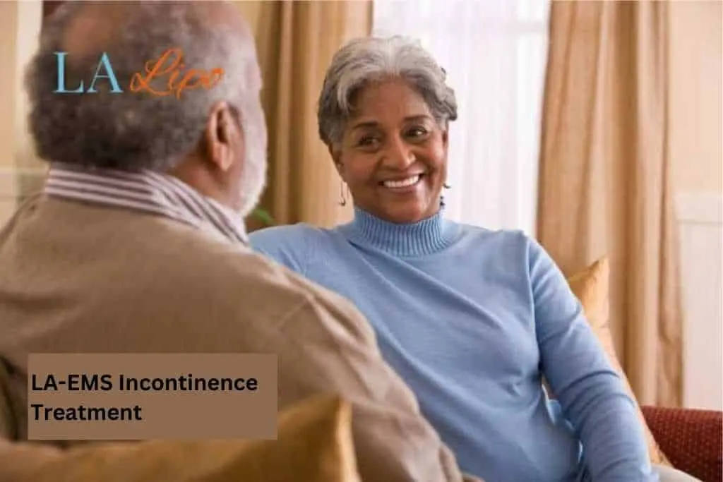 Couple sat smiling at each other - LA-EMS treatment Windlesham