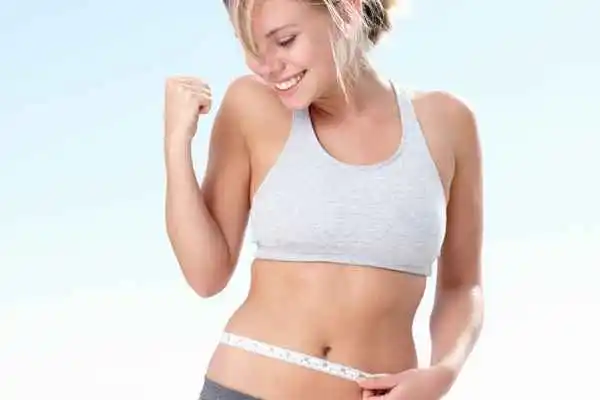 woman happy after fat reduction treatment Windlesham