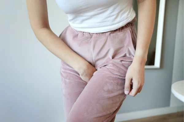 woman running for the toilet because of urinary incontinence Windlesham